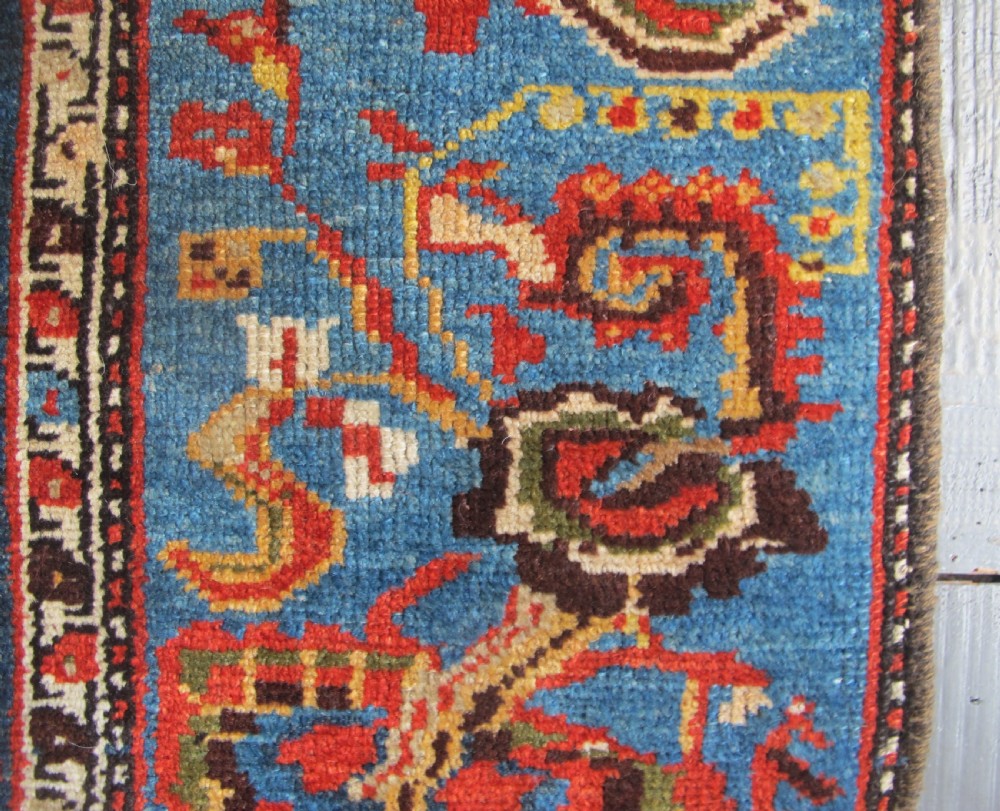 A late 19th-century hand-knotted Persian Hamadan wool rug featuring a dark navy central field surrounded by vibrant blue and red borders with intricate geometric floral motifs. View VIII