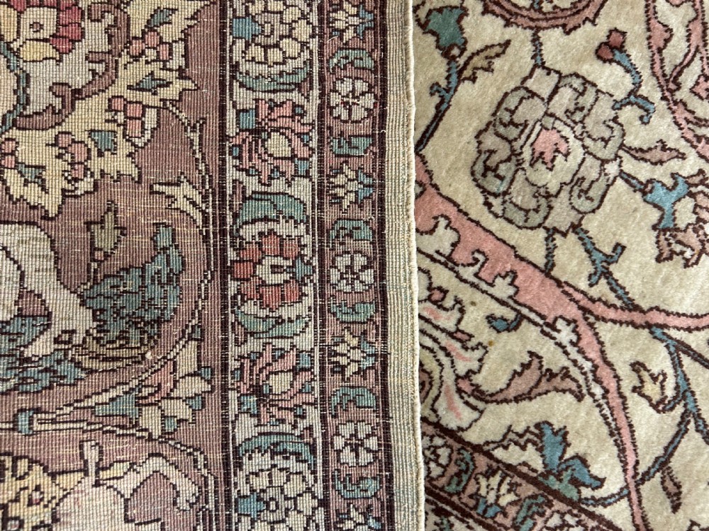 A large hand-knotted Persian Tabriz wool carpet featuring a central cream and terracotta medallion surrounded by intricate floral arabesques and border detail. View IV