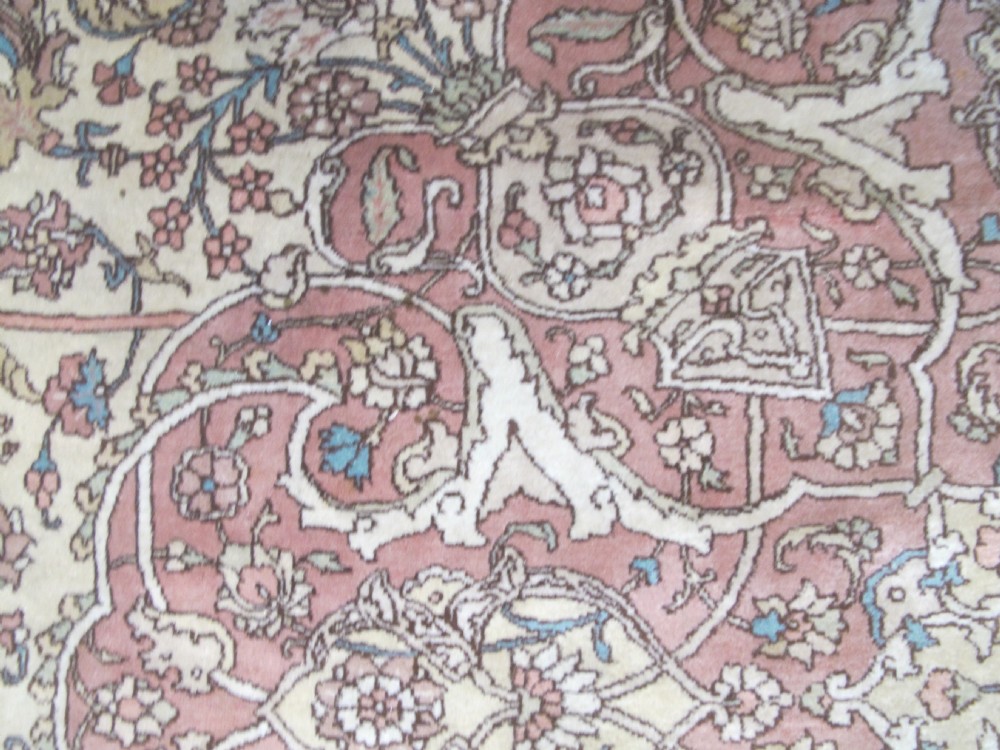 A large hand-knotted Persian Tabriz wool carpet featuring a central cream and terracotta medallion surrounded by intricate floral arabesques and border detail. View VIII