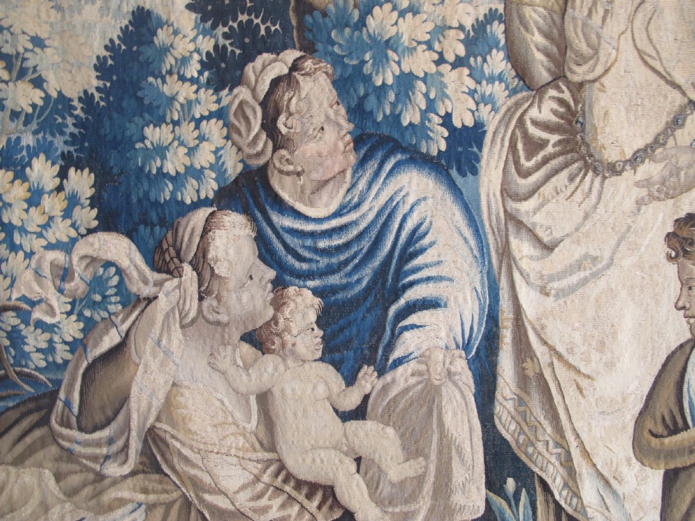 A large 17th-century woven Aubusson tapestry displaying a biblical scene with figures, hounds, and foliage in shades of blue, cream, and green. View V