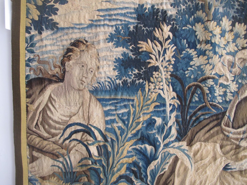 A large 17th-century woven Aubusson tapestry displaying a biblical scene with figures, hounds, and foliage in shades of blue, cream, and green. View VI