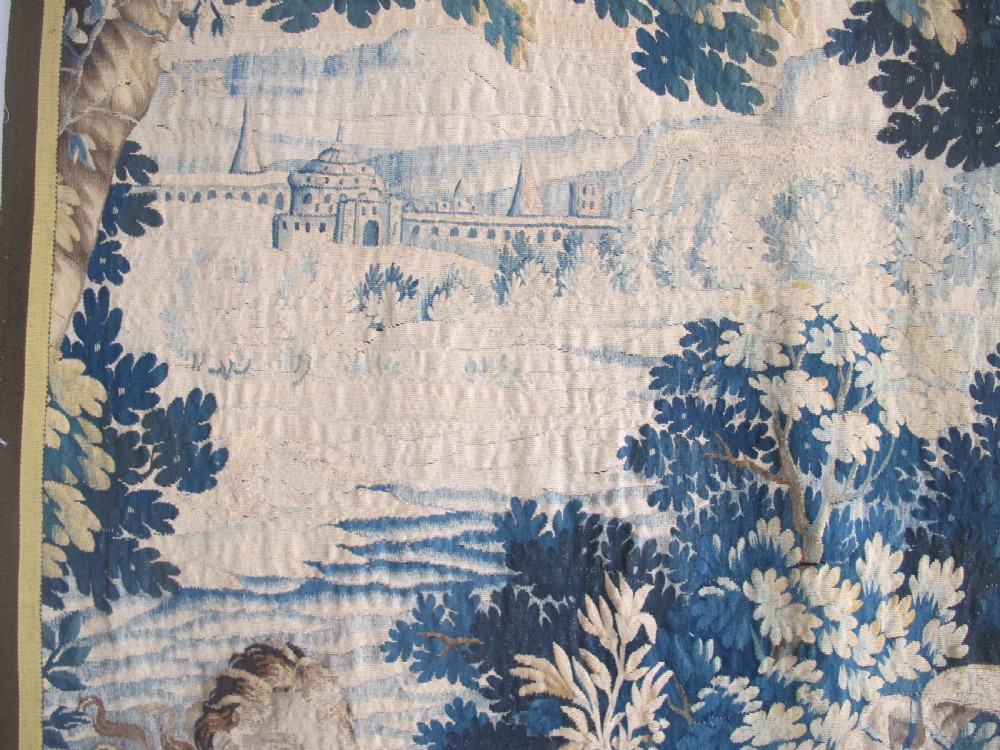 A large 17th-century woven Aubusson tapestry displaying a biblical scene with figures, hounds, and foliage in shades of blue, cream, and green. View VII