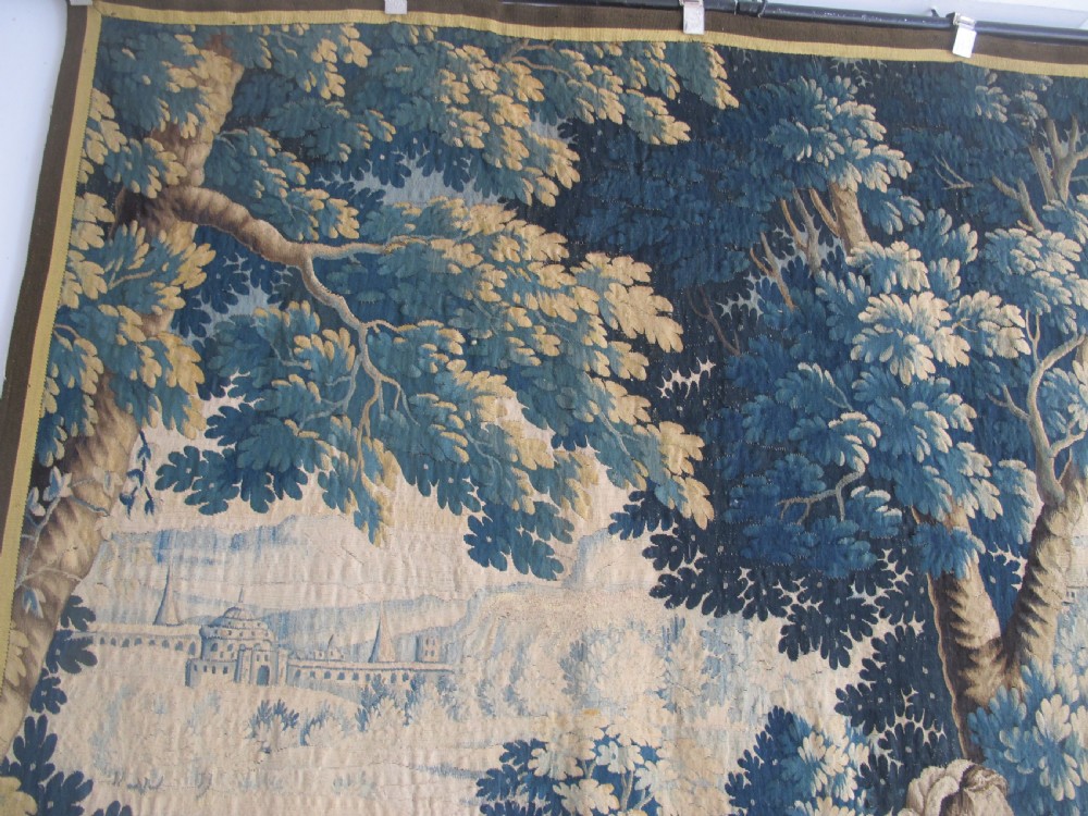 A large 17th-century woven Aubusson tapestry displaying a biblical scene with figures, hounds, and foliage in shades of blue, cream, and green. View VIII