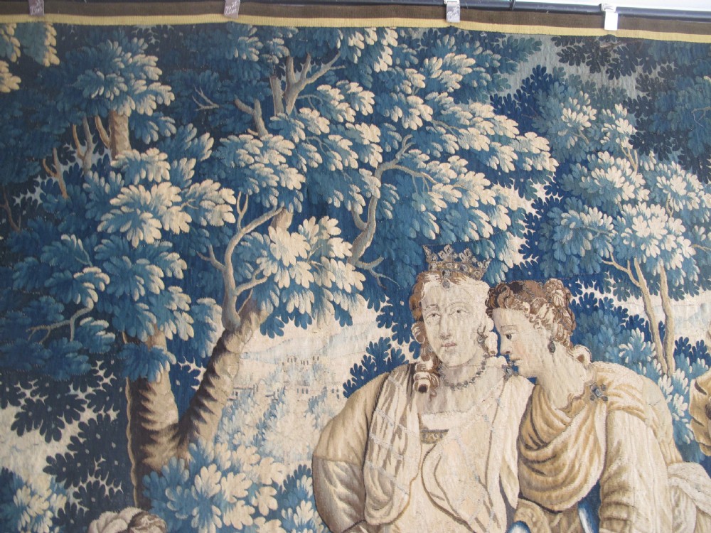 A large 17th-century woven Aubusson tapestry displaying a biblical scene with figures, hounds, and foliage in shades of blue, cream, and green. View IX
