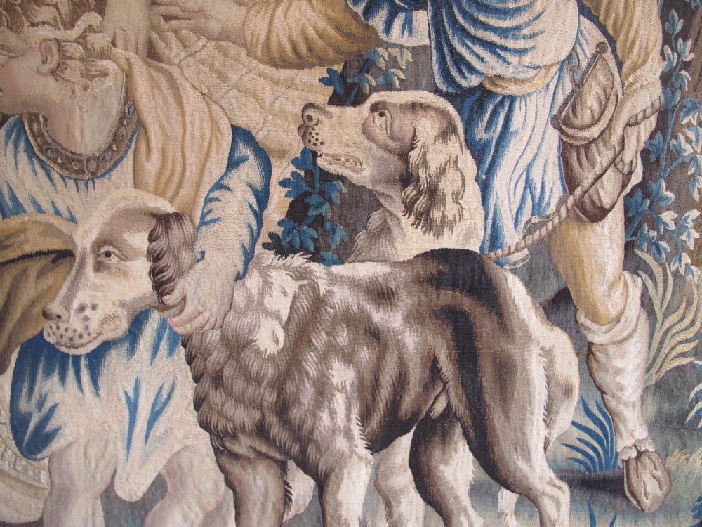 A large 17th-century woven Aubusson tapestry displaying a biblical scene with figures, hounds, and foliage in shades of blue, cream, and green. View X