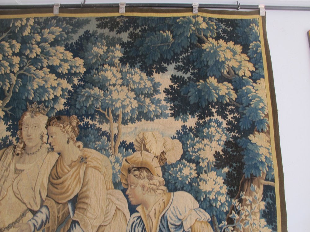 A large 17th-century woven Aubusson tapestry displaying a biblical scene with figures, hounds, and foliage in shades of blue, cream, and green. View XI