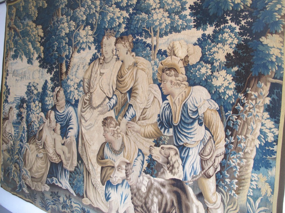 A large 17th-century woven Aubusson tapestry displaying a biblical scene with figures, hounds, and foliage in shades of blue, cream, and green. View XV