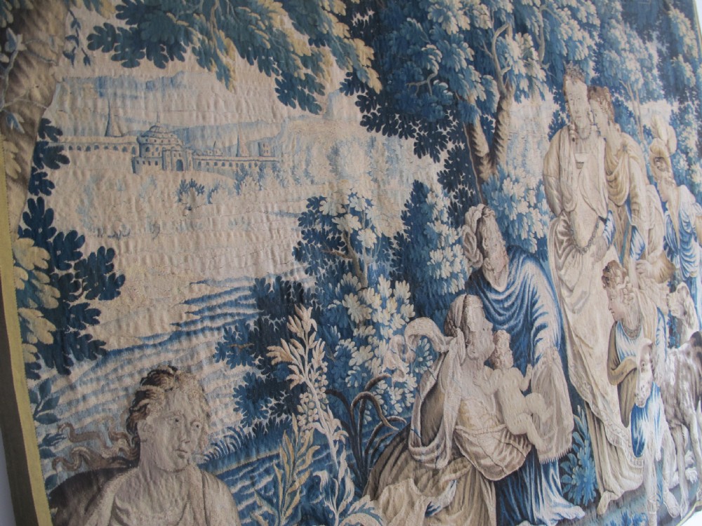 A large 17th-century woven Aubusson tapestry displaying a biblical scene with figures, hounds, and foliage in shades of blue, cream, and green. View XVI