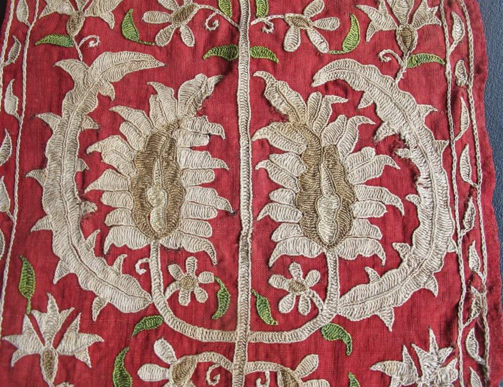 A long, narrow 19th-century Ottoman textile fragment featuring intricate gold botanical embroidery on a vibrant red background. View IV