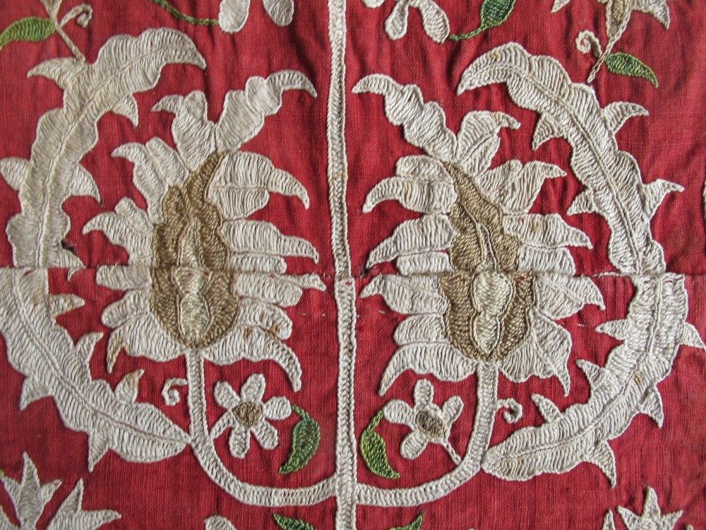 A long, narrow 19th-century Ottoman textile fragment featuring intricate gold botanical embroidery on a vibrant red background. View VII