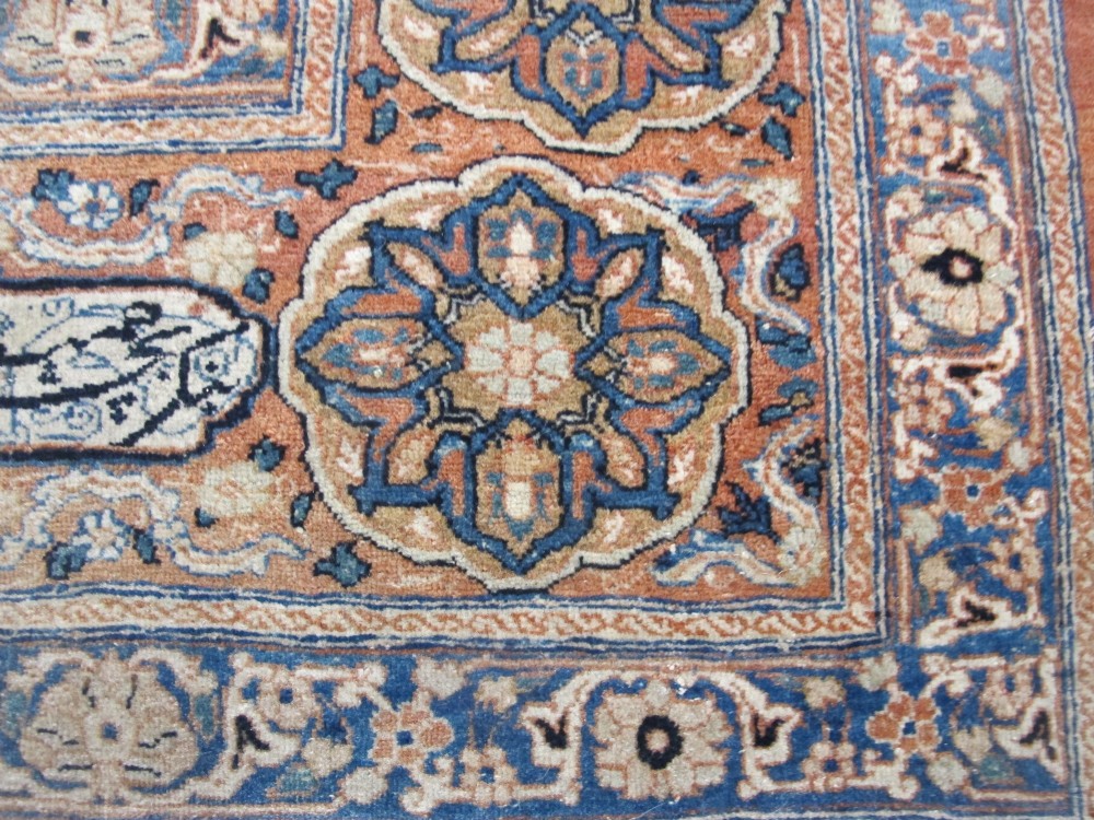 An antique Persian Tabriz carpet featuring a central medallion surrounded by floral motifs in terracotta and pale blue with calligraphic border cartouches. View VII