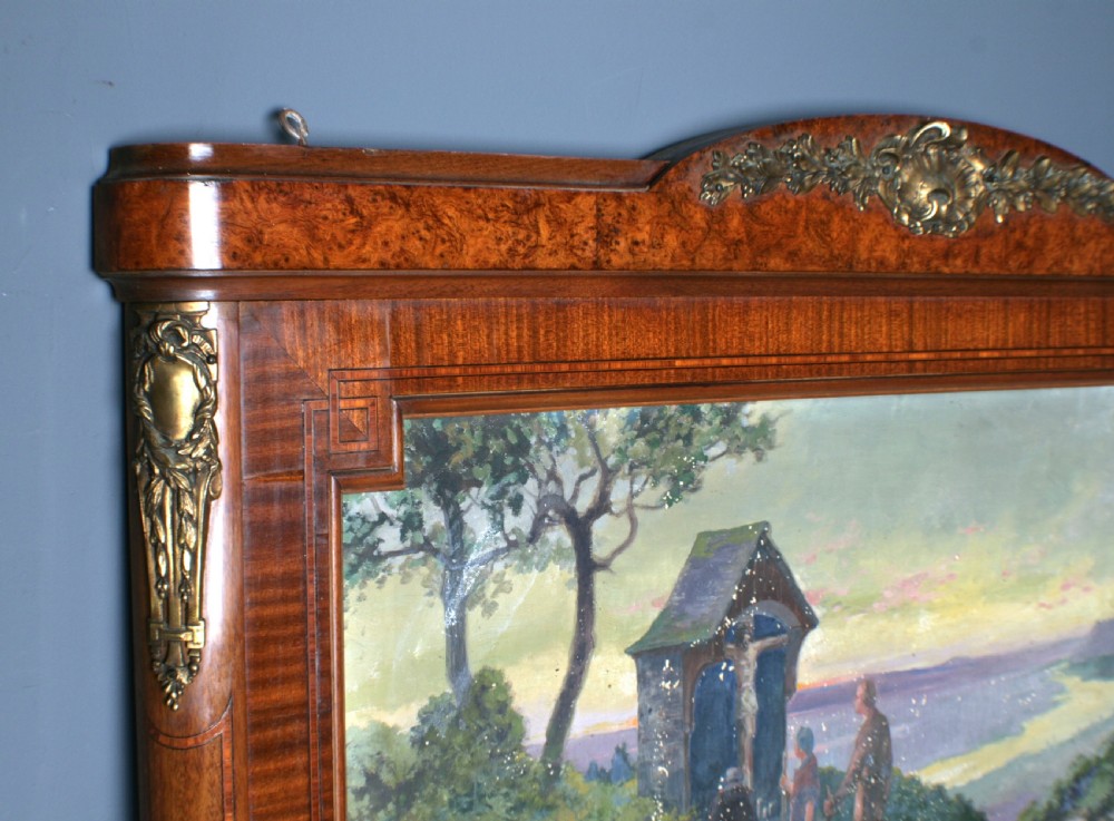 A tall rectangular French walnut wall mirror featuring an inset oil painting of a landscape above a large rectangular glass pane. View IV