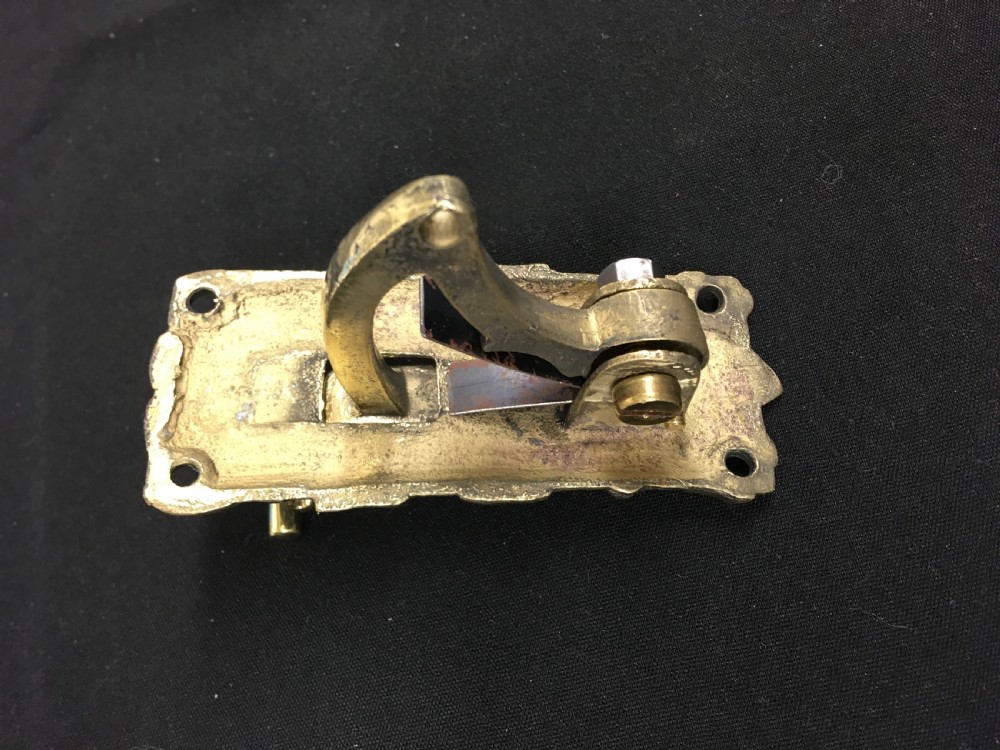 A cast brass Victorian door bell pull featuring intricate relief ivy leaf and berry detailing with a central mechanical lever. View III