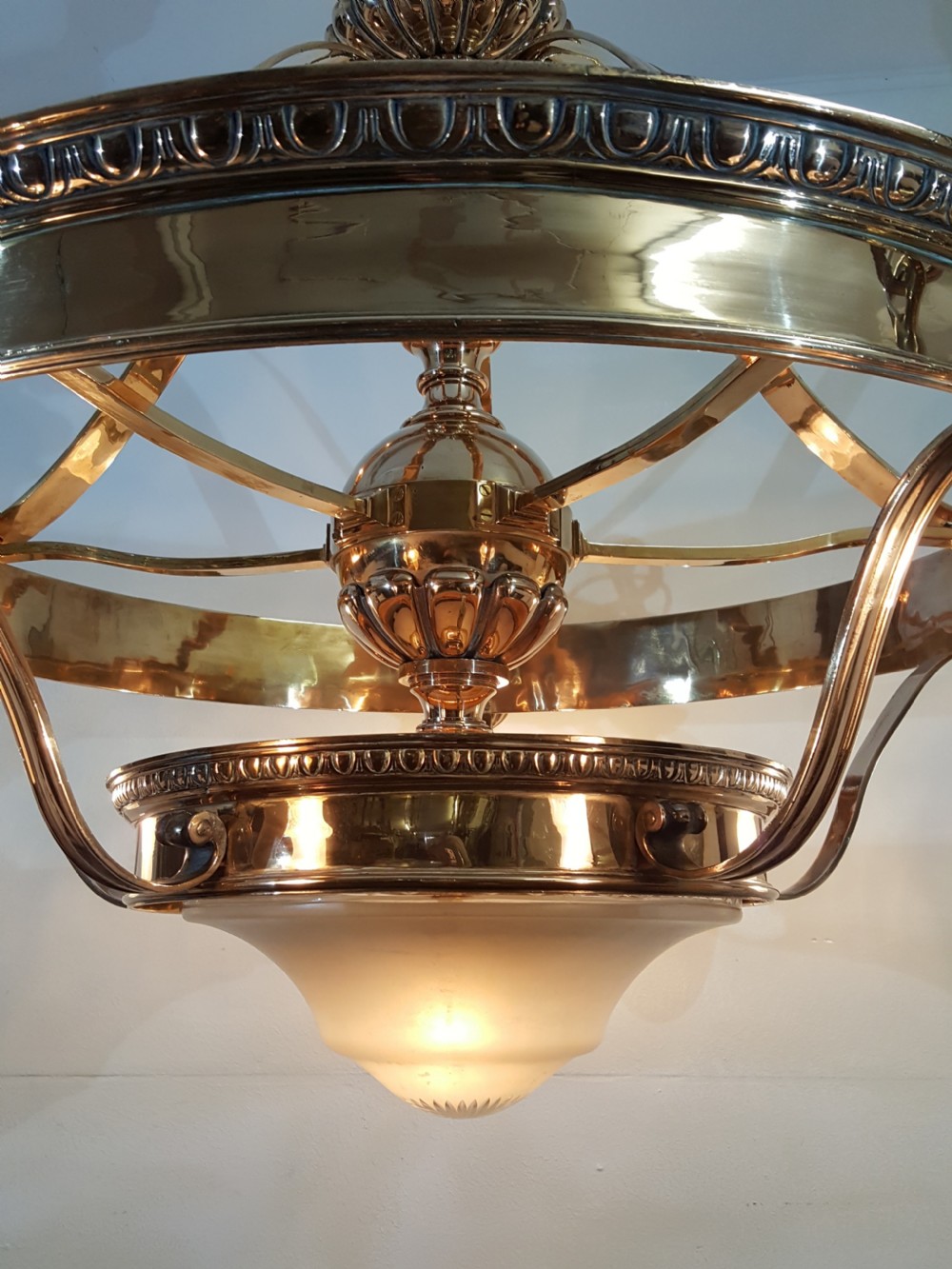 A Victorian style polished bronze and brass ceiling light fixture featuring a central ring frame with scrolled upper supports and frosted cut glass shades. View III