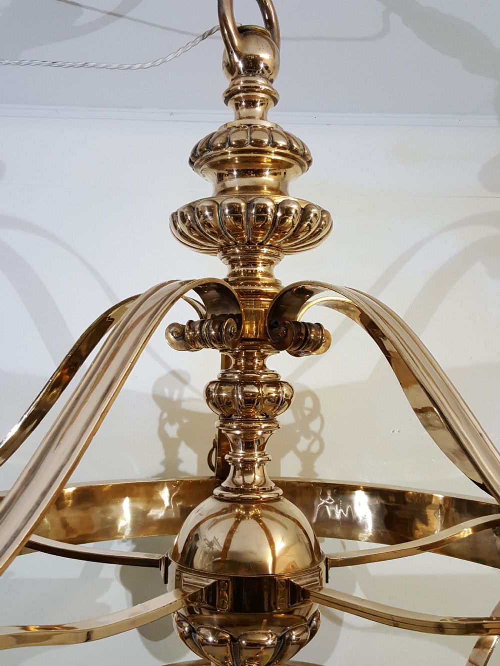 A Victorian style polished bronze and brass ceiling light fixture featuring a central ring frame with scrolled upper supports and frosted cut glass shades. View VIII