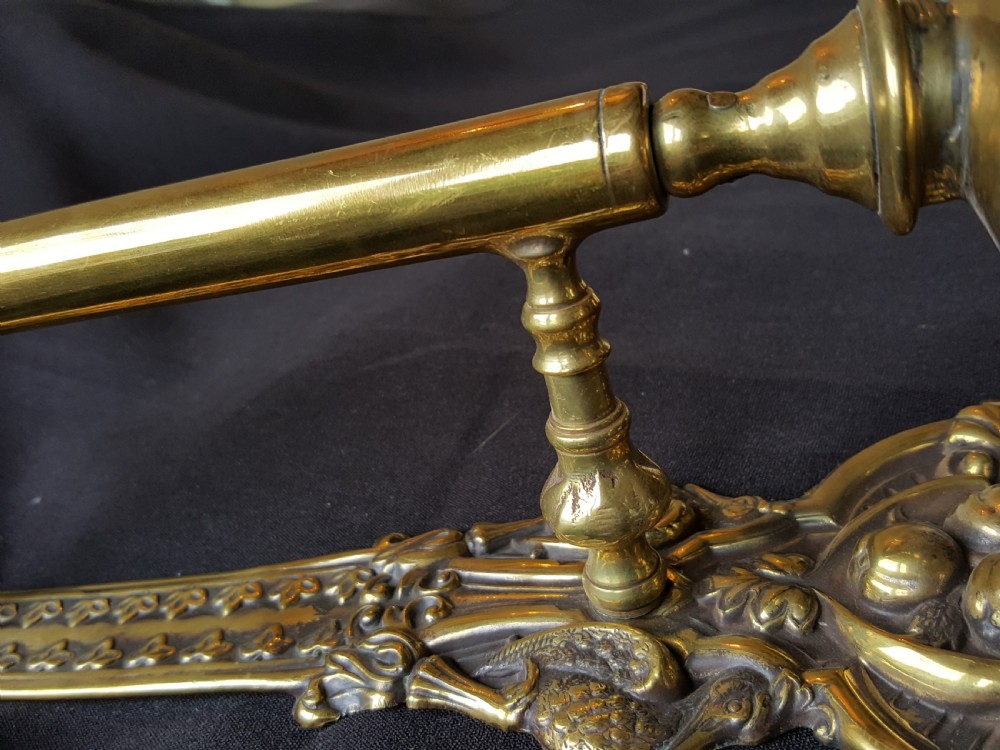 An ornate Victorian solid brass mechanical door bell pull featuring a faceted knob, rod lever mechanism, and cast foliate backplate. View IV