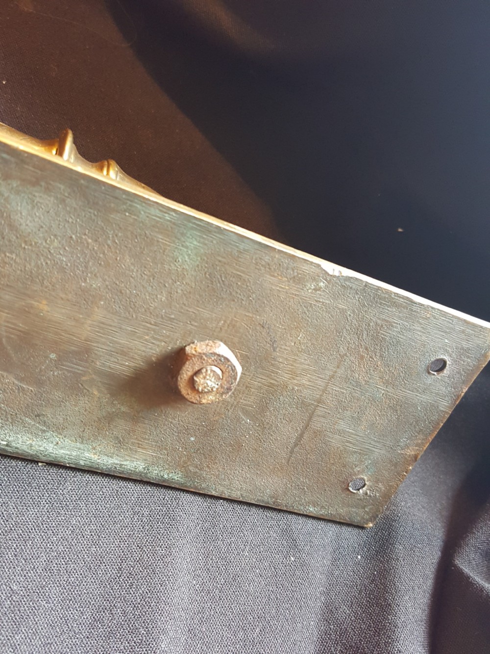 A solid brass Edwardian door pull handle mounted on a rectangular backplate with four corner mounting holes. View IV