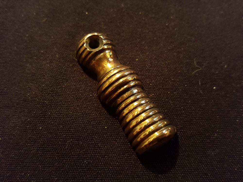 A pair of turned, polished brass keyhole escutcheons featuring a ribbed beehive design with a single mounting hole at the top. View II