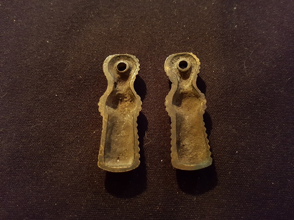 A pair of turned, polished brass keyhole escutcheons featuring a ribbed beehive design with a single mounting hole at the top. View III