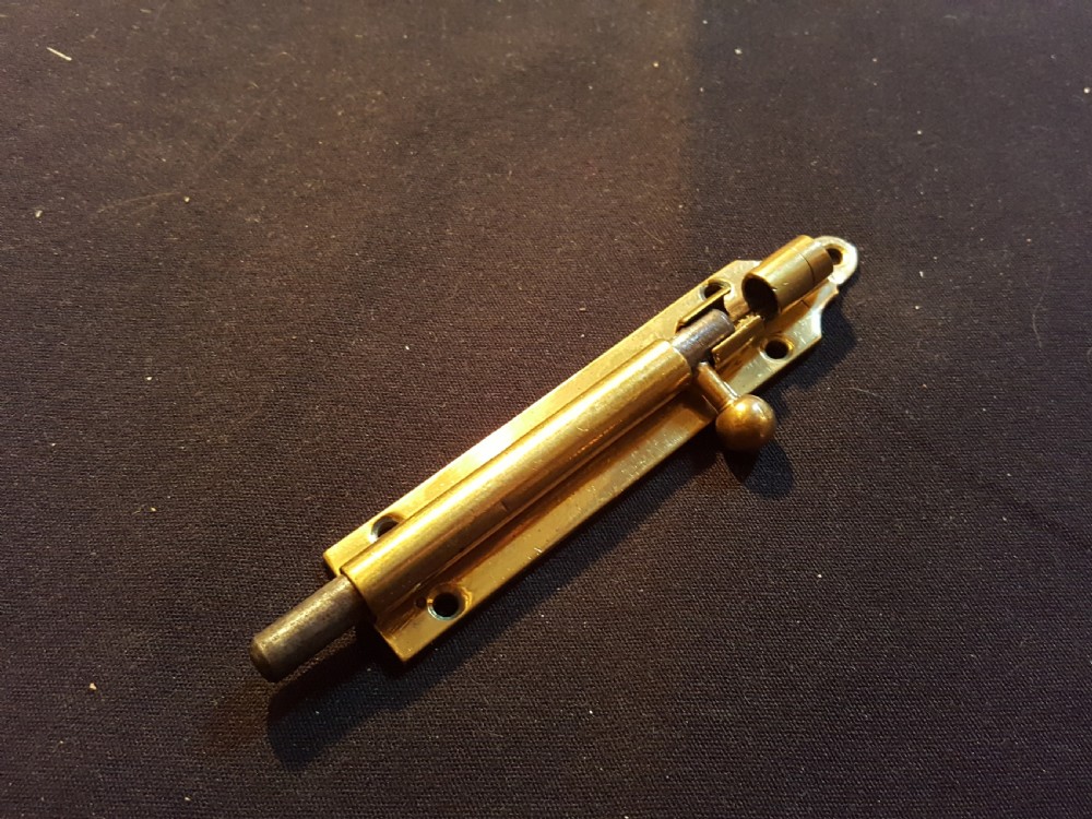 One Victorian Brass Bolt with Keep. View III