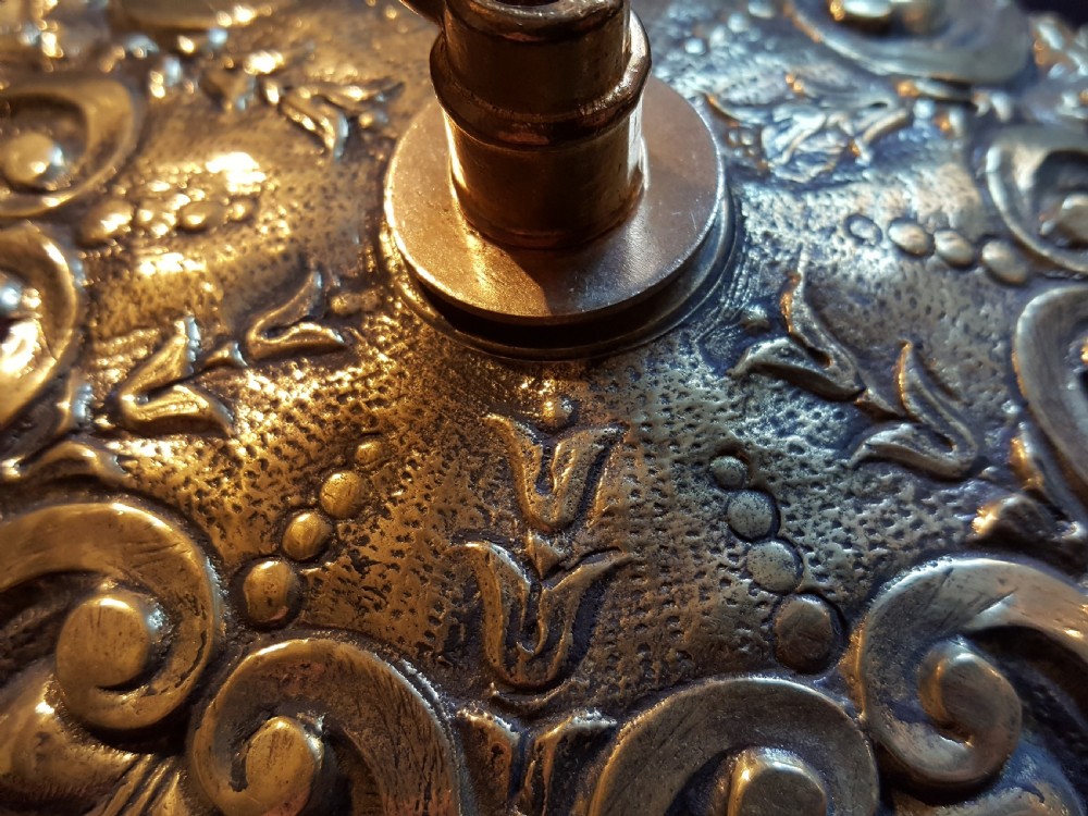 An ornate circular Victorian cast brass ceiling rose featuring relief foliage decoration and a central hanging hook. View III