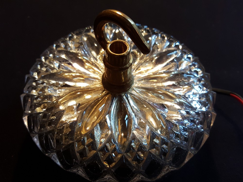 A pair of Victorian clear glass ceiling roses featuring central brass mounting hooks and diamond cut glass detailing. View III