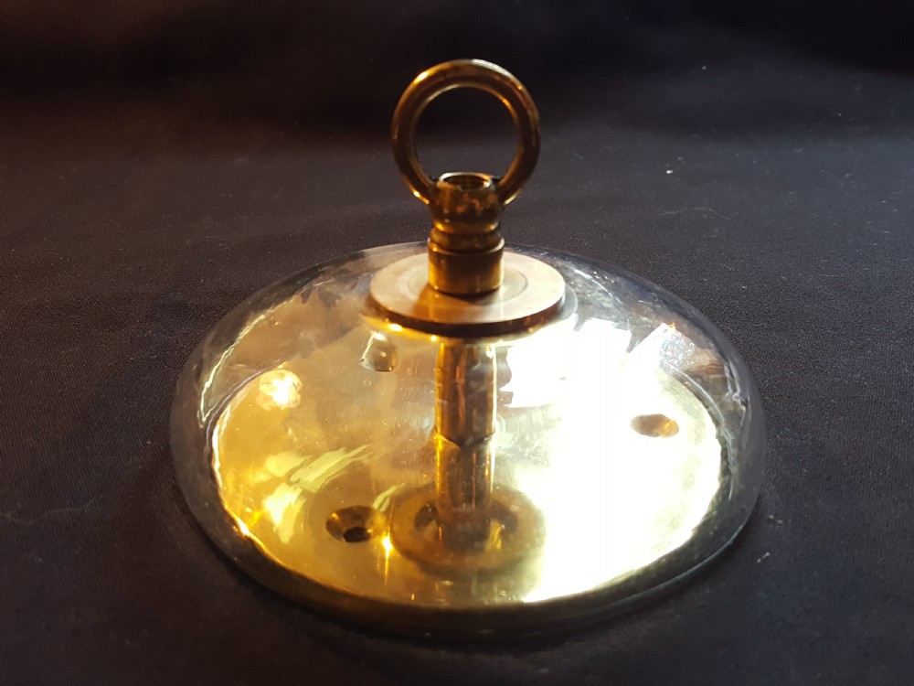 A pair of Victorian clear glass ceiling roses featuring central brass mounting hooks and diamond cut glass detailing. View V
