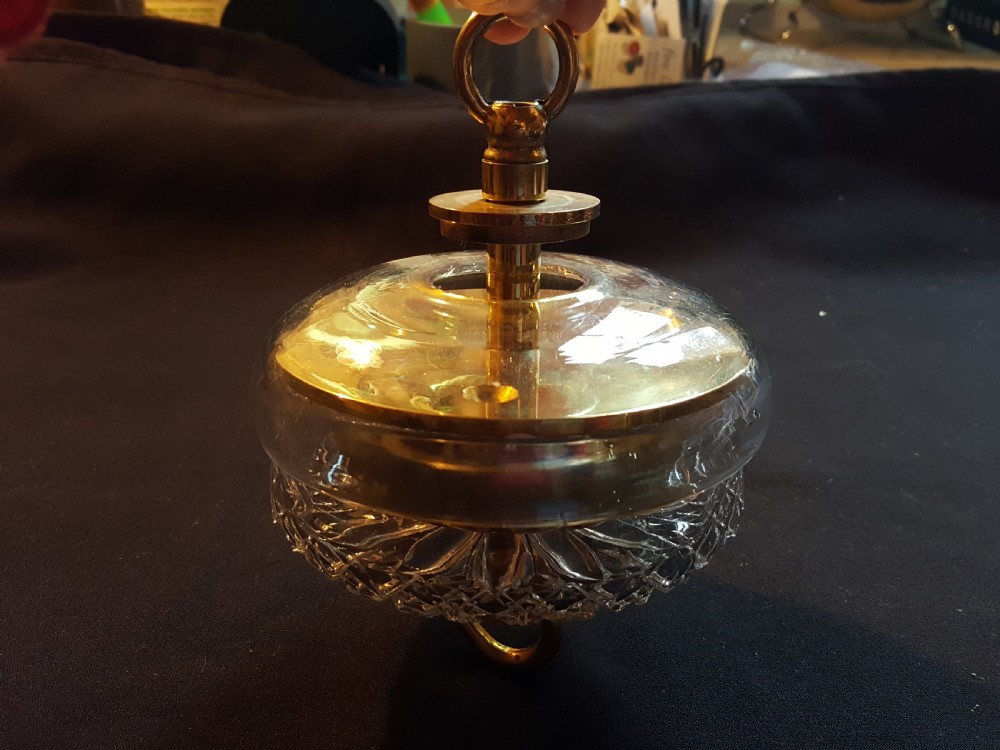 A pair of Victorian clear glass ceiling roses featuring central brass mounting hooks and diamond cut glass detailing. View VI
