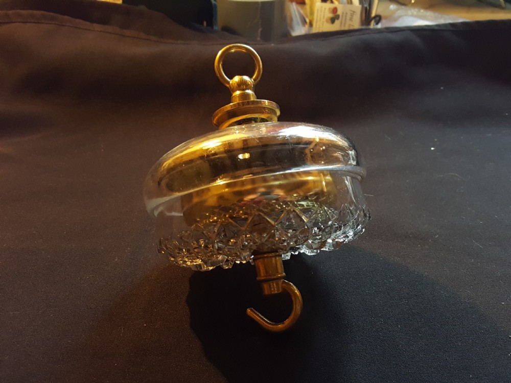 A pair of Victorian clear glass ceiling roses featuring central brass mounting hooks and diamond cut glass detailing. View VII