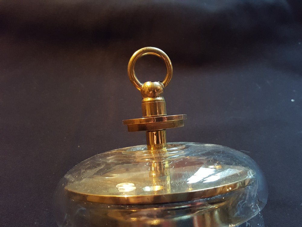 A pair of Victorian clear glass ceiling roses featuring central brass mounting hooks and diamond cut glass detailing. View VIII