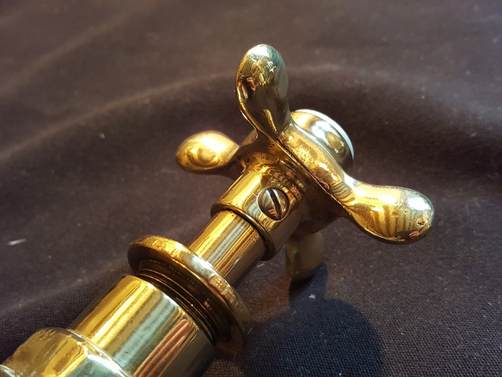 A pair of restored Victorian polished brass bath taps featuring crosshead handles and threaded tails. View VI