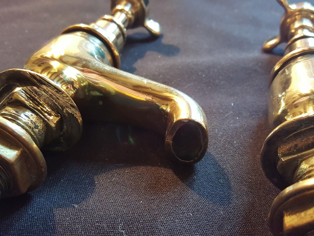 A pair of restored Victorian polished brass bath taps featuring crosshead handles and threaded mounting pillars. View III