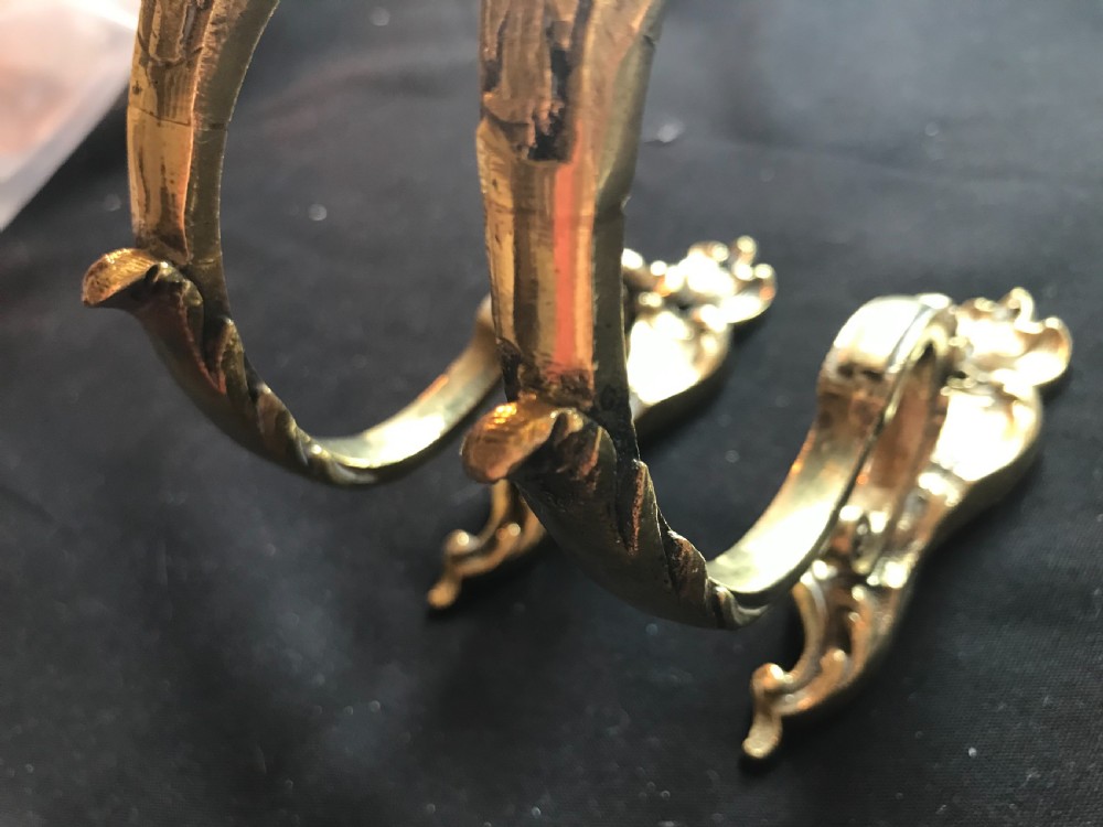 A pair of heavy cast brass curtain tiebacks featuring sculpted acanthus leaf and C-scroll motifs. View III
