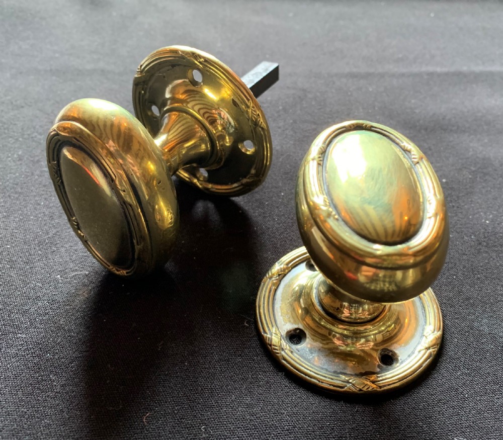 One Pair of Brass Regency Oval Door Knobs.