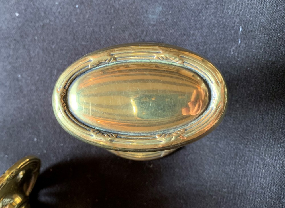 One Pair of Brass Regency Oval Door Knobs. View V