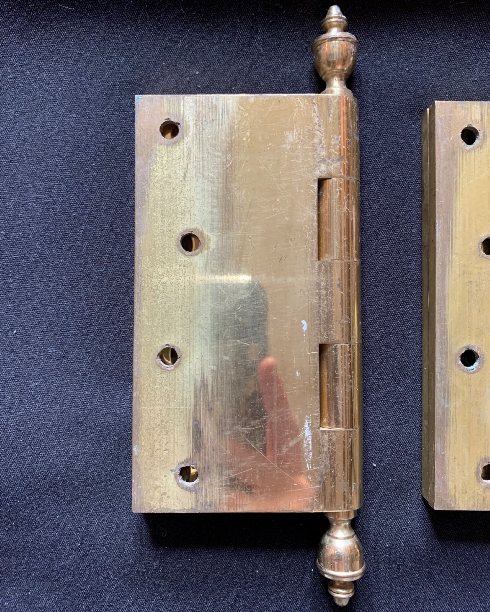A pair of solid brass Victorian butt door hinges featuring turned urn finials at the top and bottom of each hinge pin. View III