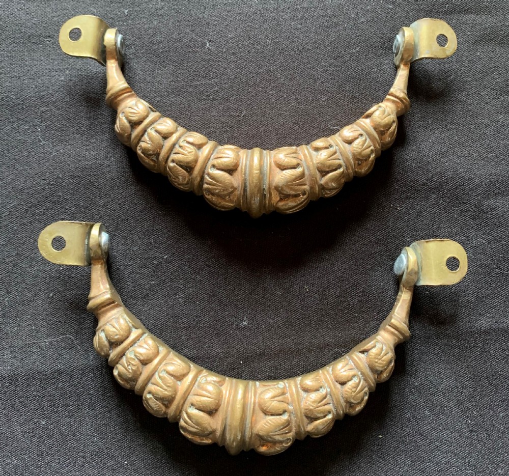 A pair of carved Victorian bronze drop handles featuring leaf detail and integrated swivel mounting loops. View III