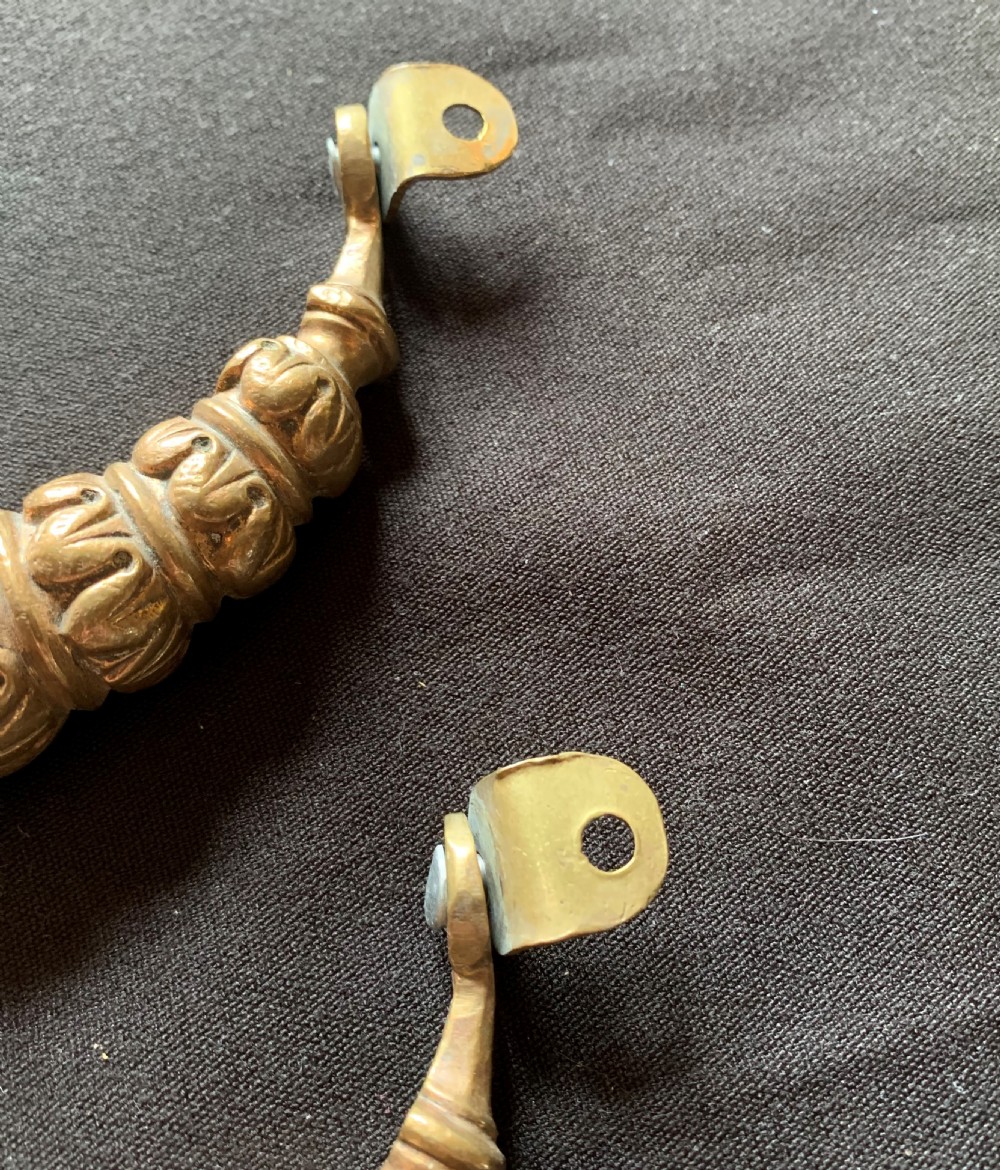 A pair of carved Victorian bronze drop handles featuring leaf detail and integrated swivel mounting loops. View IV