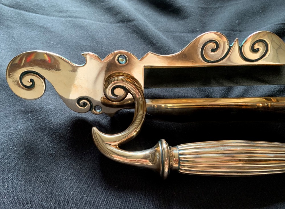 A polished Victorian bronze letter plate featuring an integrated scroll door pull handle and engraved scrollwork details. View II