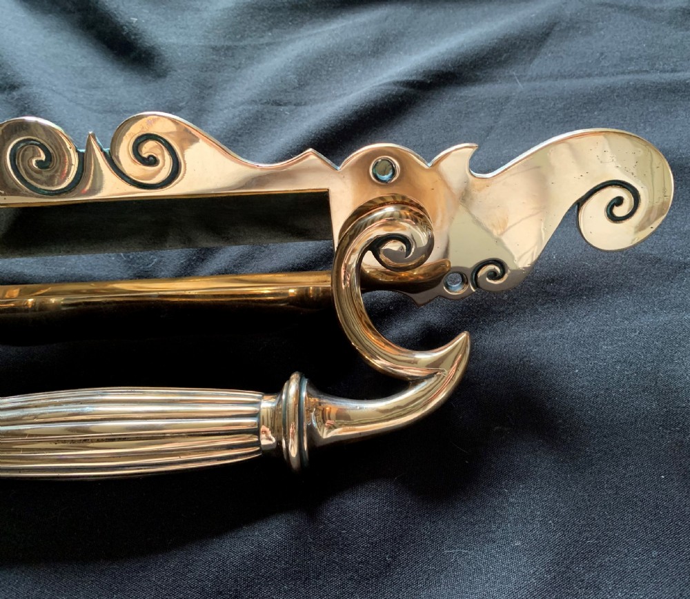 A polished Victorian bronze letter plate featuring an integrated scroll door pull handle and engraved scrollwork details. View IV