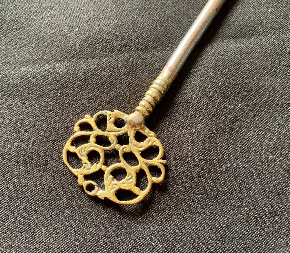 A rectangular French Victorian brass and polished steel rim lock with a beaded edge frame and an ornate matching key. View VI