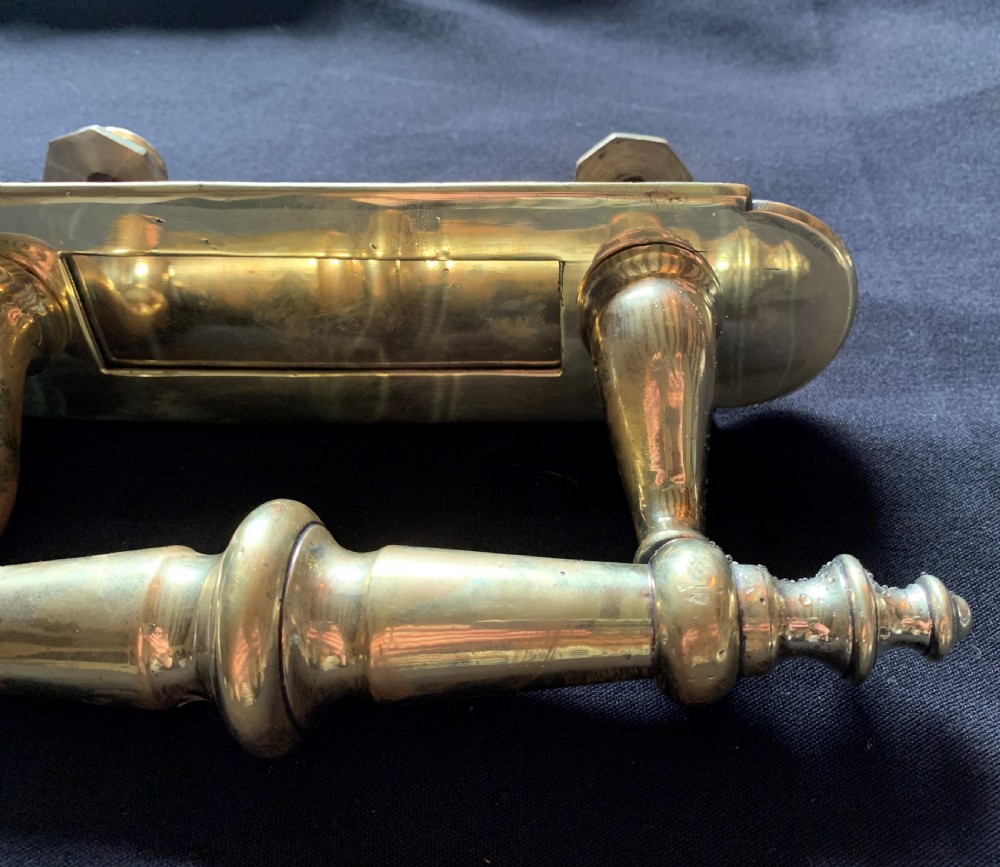 A polished brass Victorian letter box plate combined with an integrated turned door pull handle and rear fixing bolts. View II