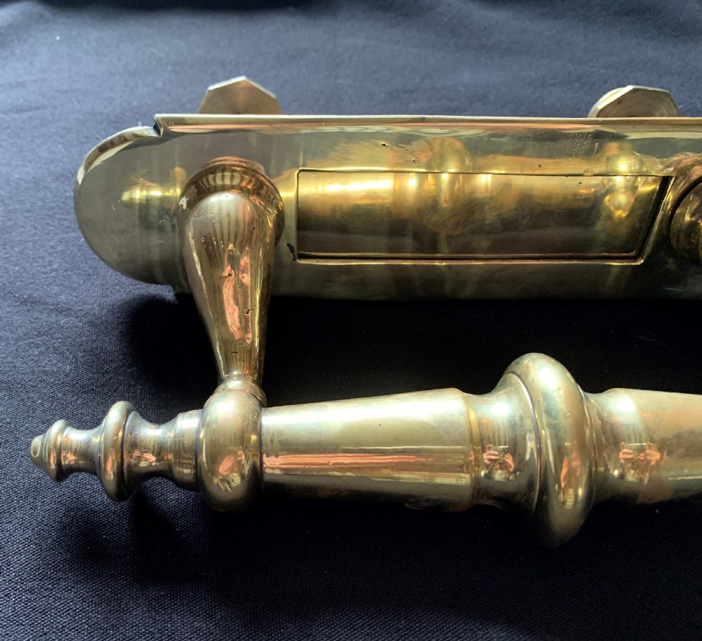 A polished brass Victorian letter box plate combined with an integrated turned door pull handle and rear fixing bolts. View III