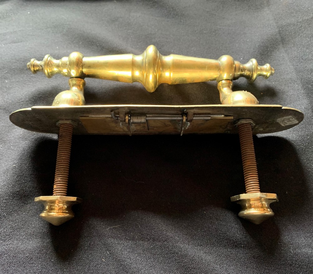 A polished brass Victorian letter box plate combined with an integrated turned door pull handle and rear fixing bolts. View V