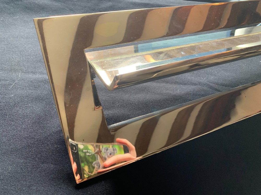 A polished brass rectangular Victorian letter box plate featuring a hinged central flap with an ergonomic lower lip. View III