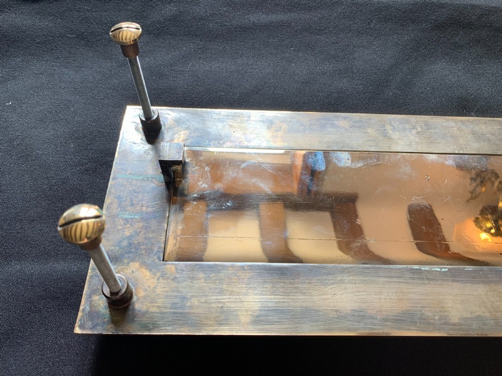 A polished brass rectangular Victorian letter box plate featuring a hinged central flap with an ergonomic lower lip. View V