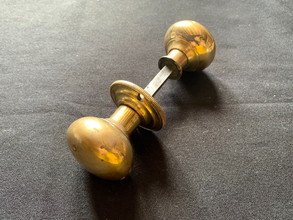 One Pair of Brass Georgian Rim Lock Door Knobs.
