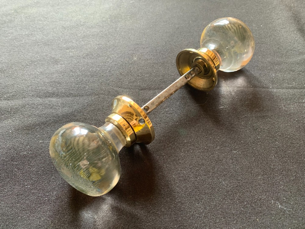 One Pair of Brass & Glass Regency Door Knobs.