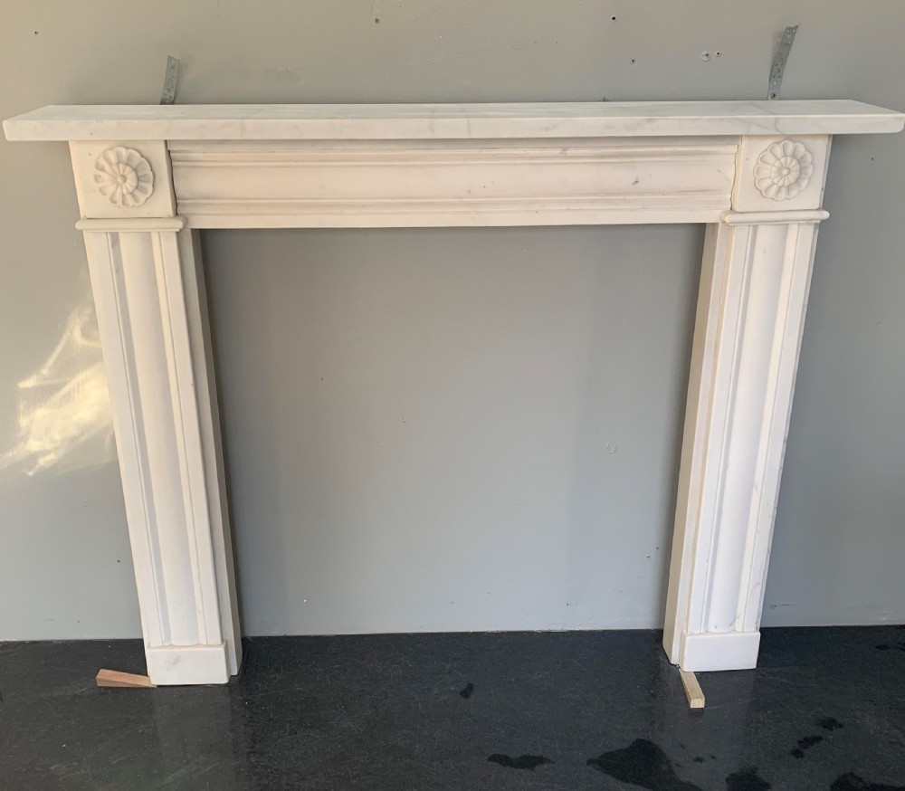 Rebate Regency White Statuary Carved Marble Surround.