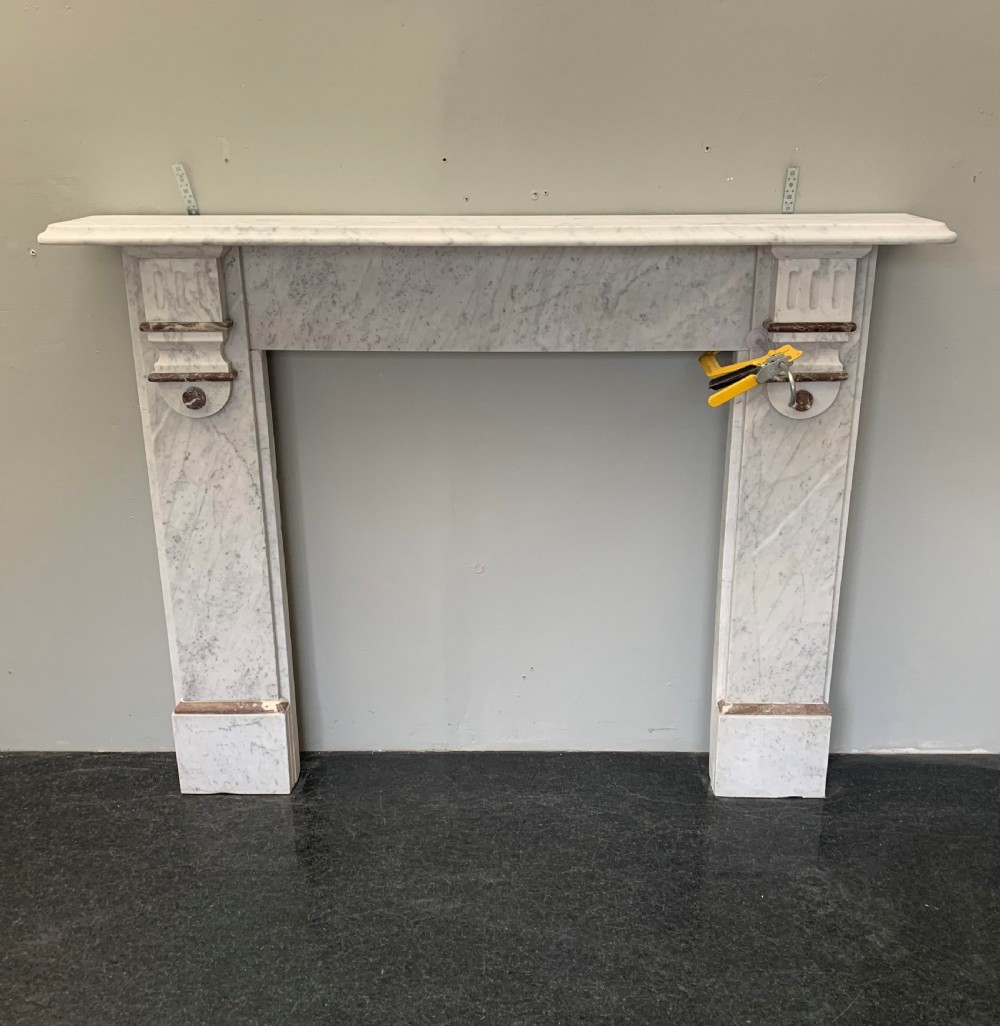 1920's Embellished Brown Marble Fireplace Surround.